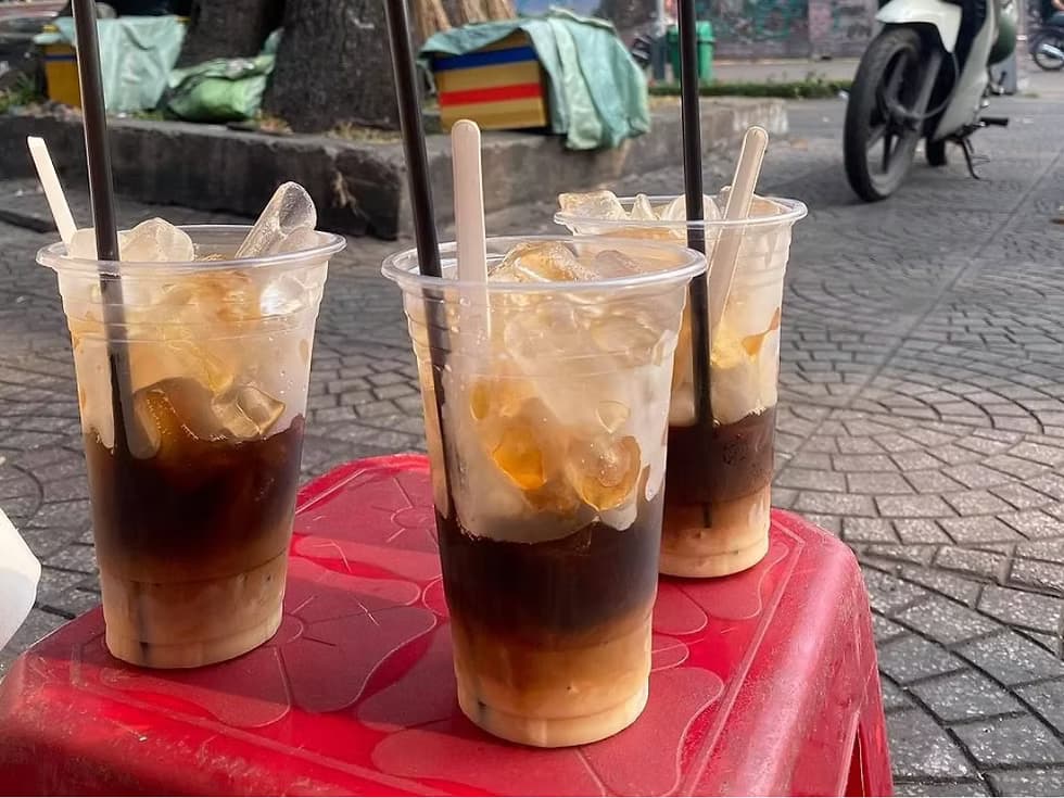 Glass of ca phe sua da with condensed milk and ice
