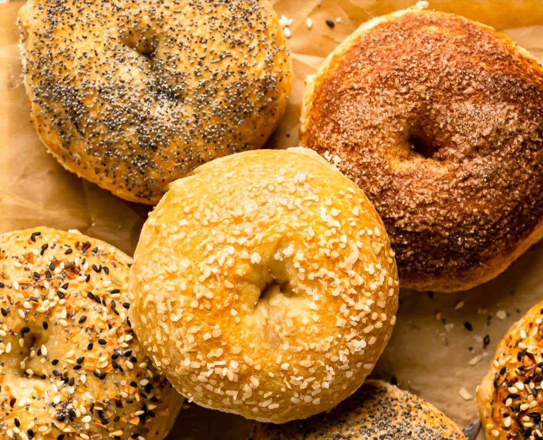 Freshly baked New York bagels on a tray