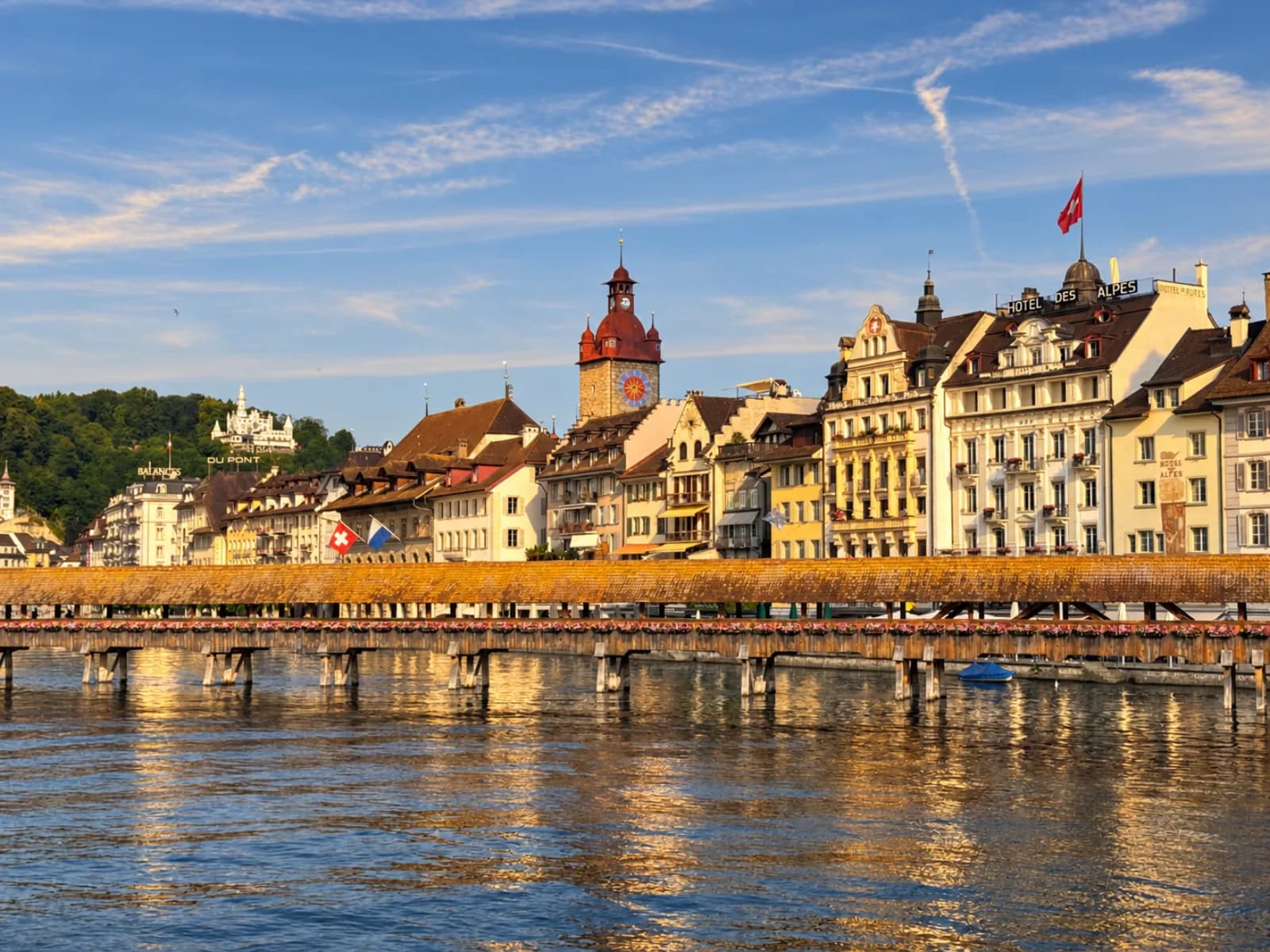 Lucerne waterfront with historic buildings and Alpine mountains