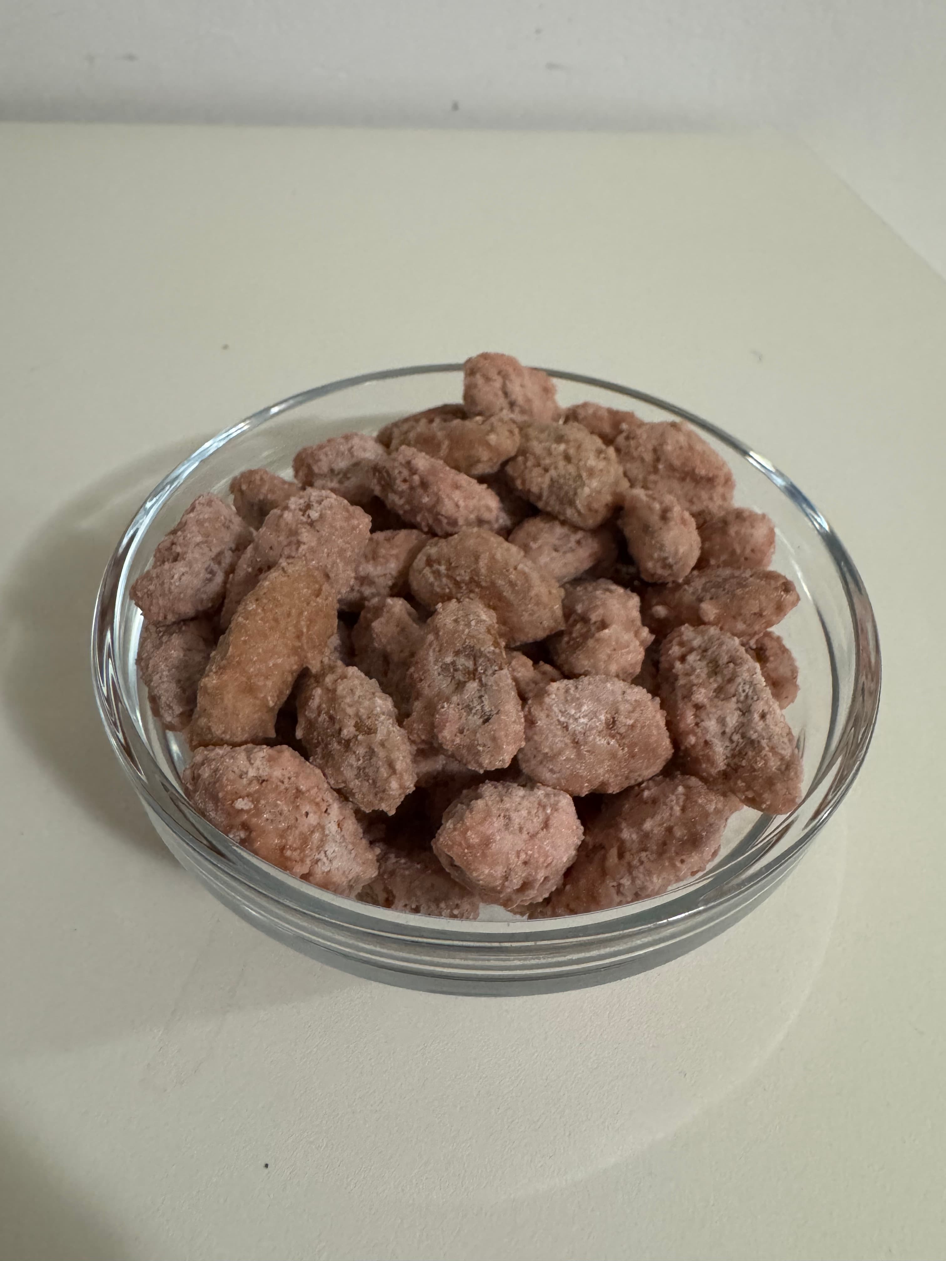 Glass bowl filled with candied walnuts