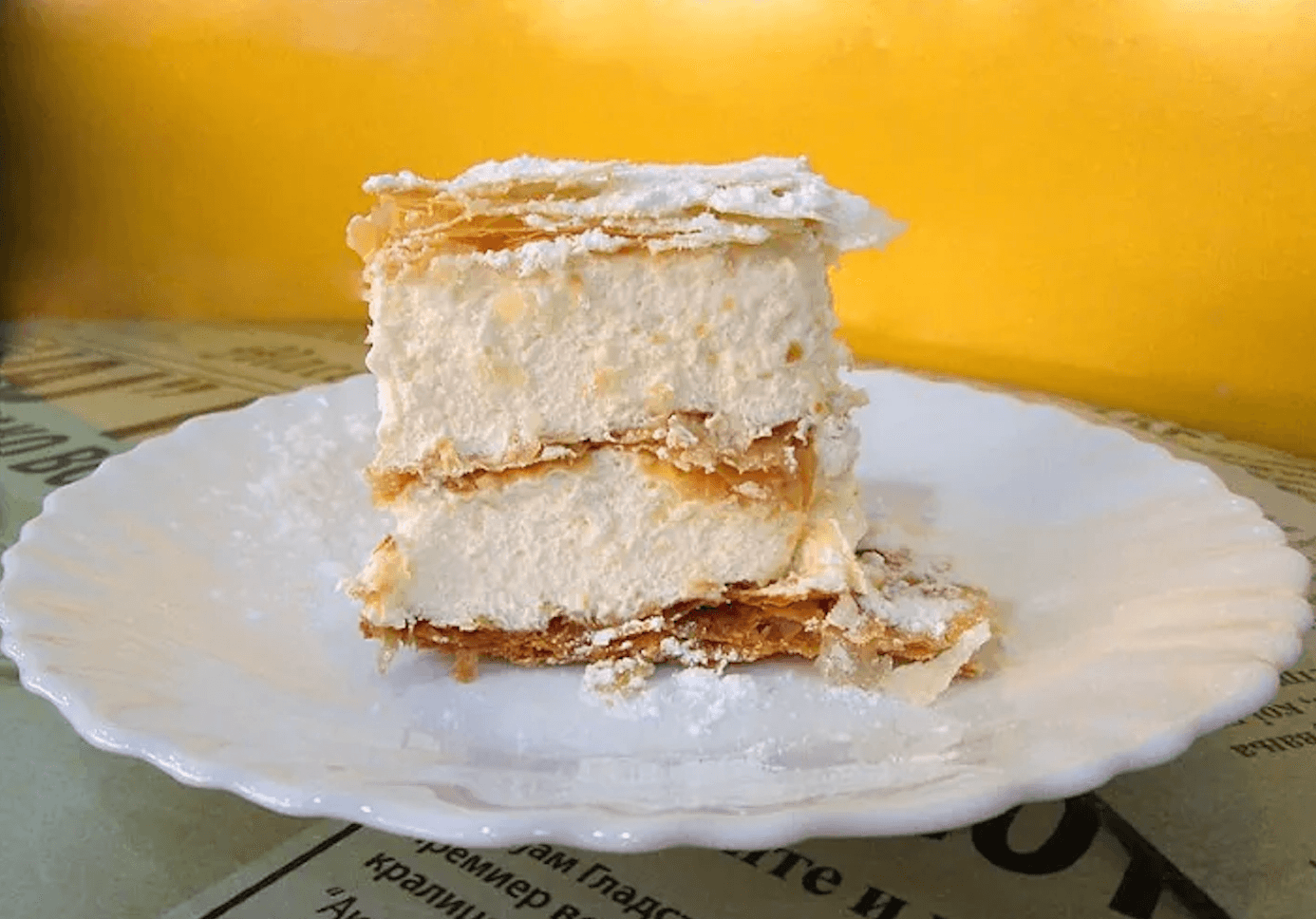 Slice of Krempita cream cake on a plate