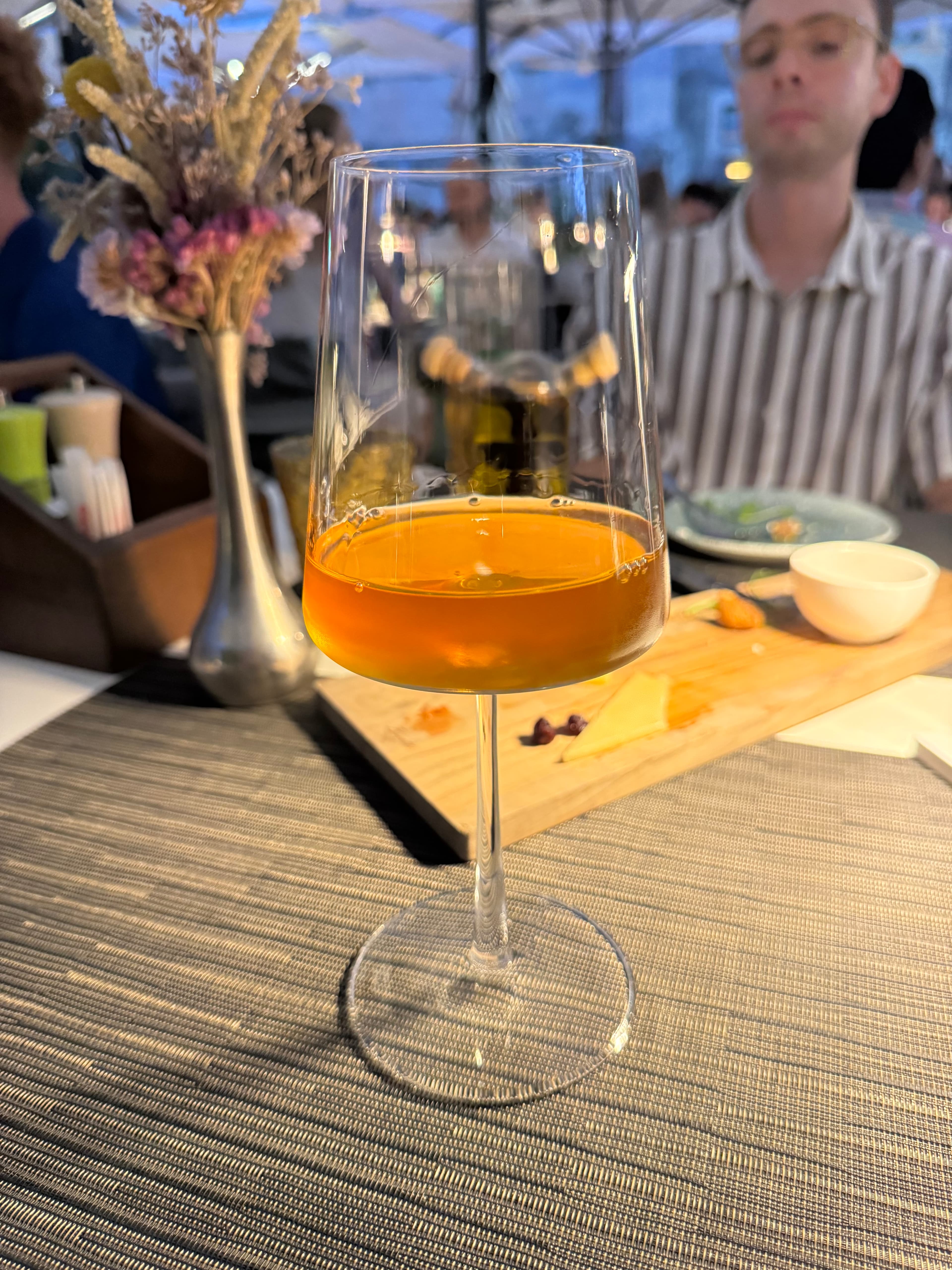 Glass of orange wine at a table in Dubrovnik