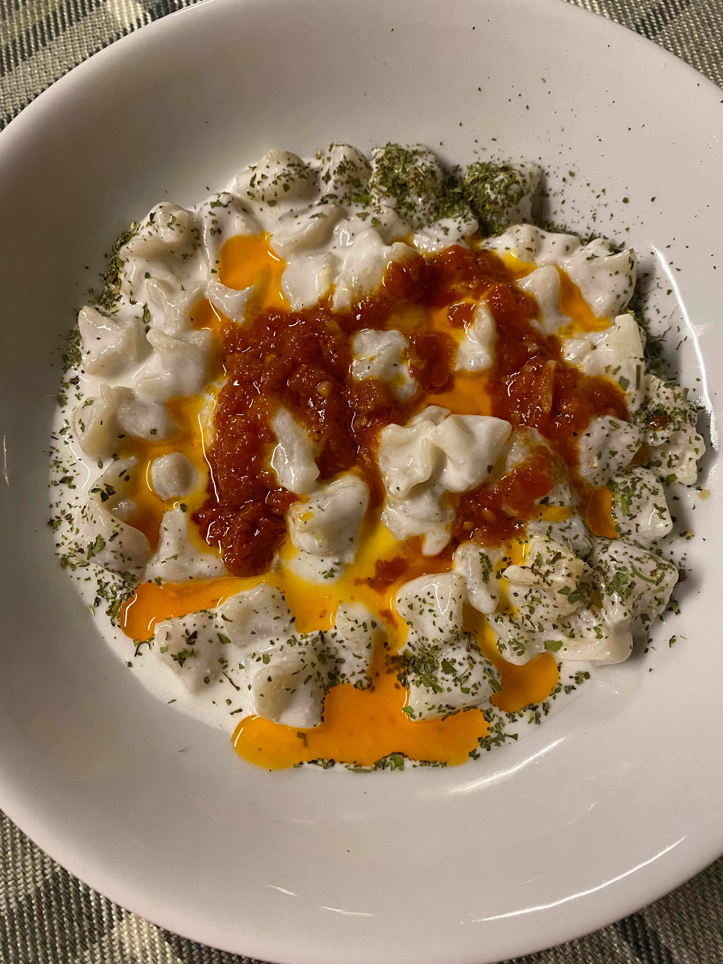Turkish manti dumplings with yogurt and butter sauce