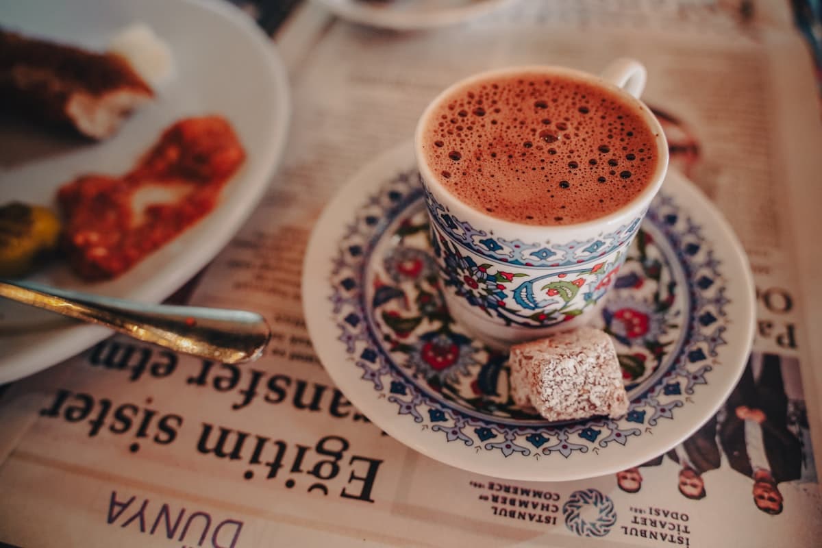 A cup of Turkish coffee with Turkish delight on the side