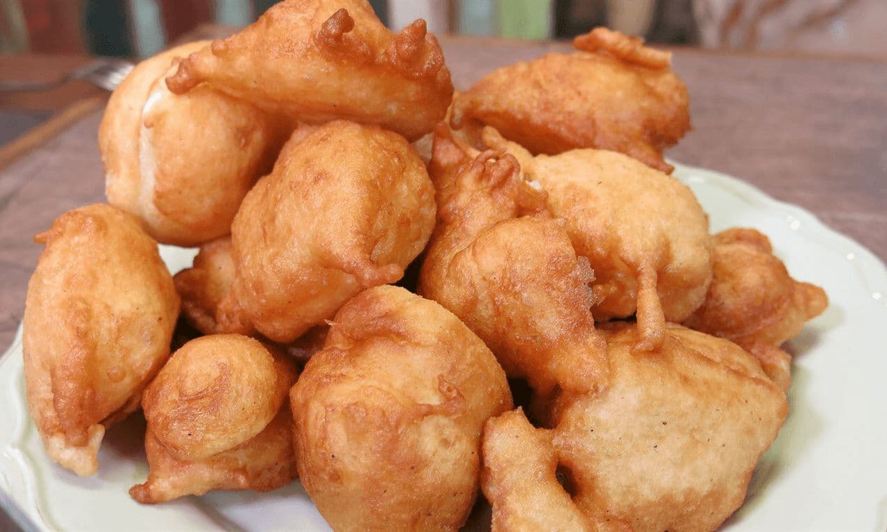 Golden priganice fritters on a plate in Kotor