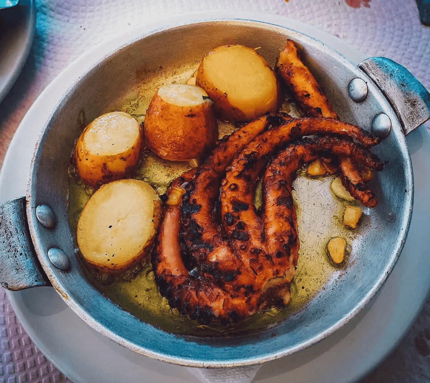 Polvo grelhado, or grilled octopus, plated in Lisbon