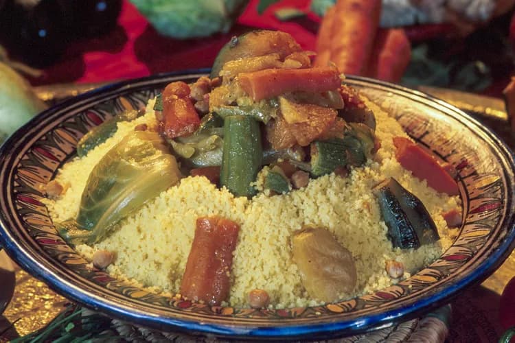 Moroccan couscous topped with vegetables and meat