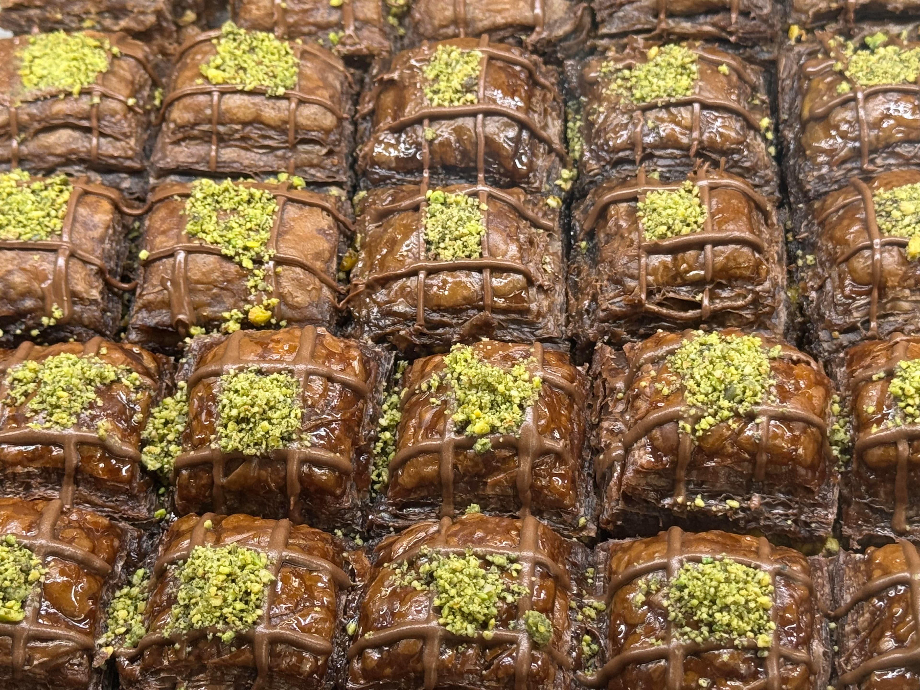 Tray of baklava pieces topped with pistachios in Mostar