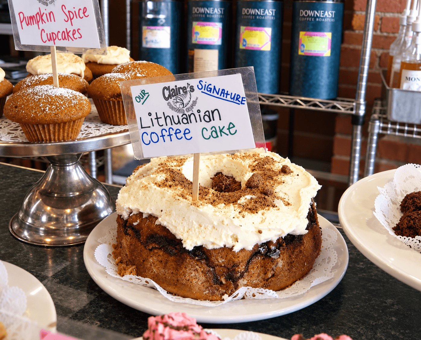 Lithuanian coffee cake with cinnamon, nuts, and frosting displayed at a New Haven bakery