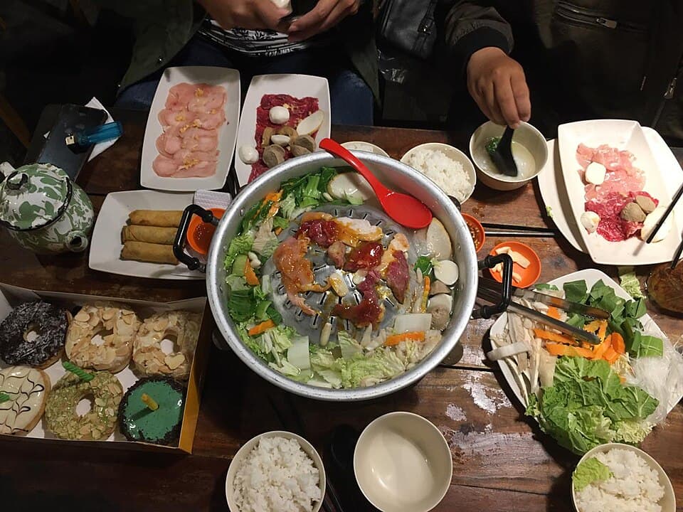 Japanese shabu shabu hot pot with sliced meat