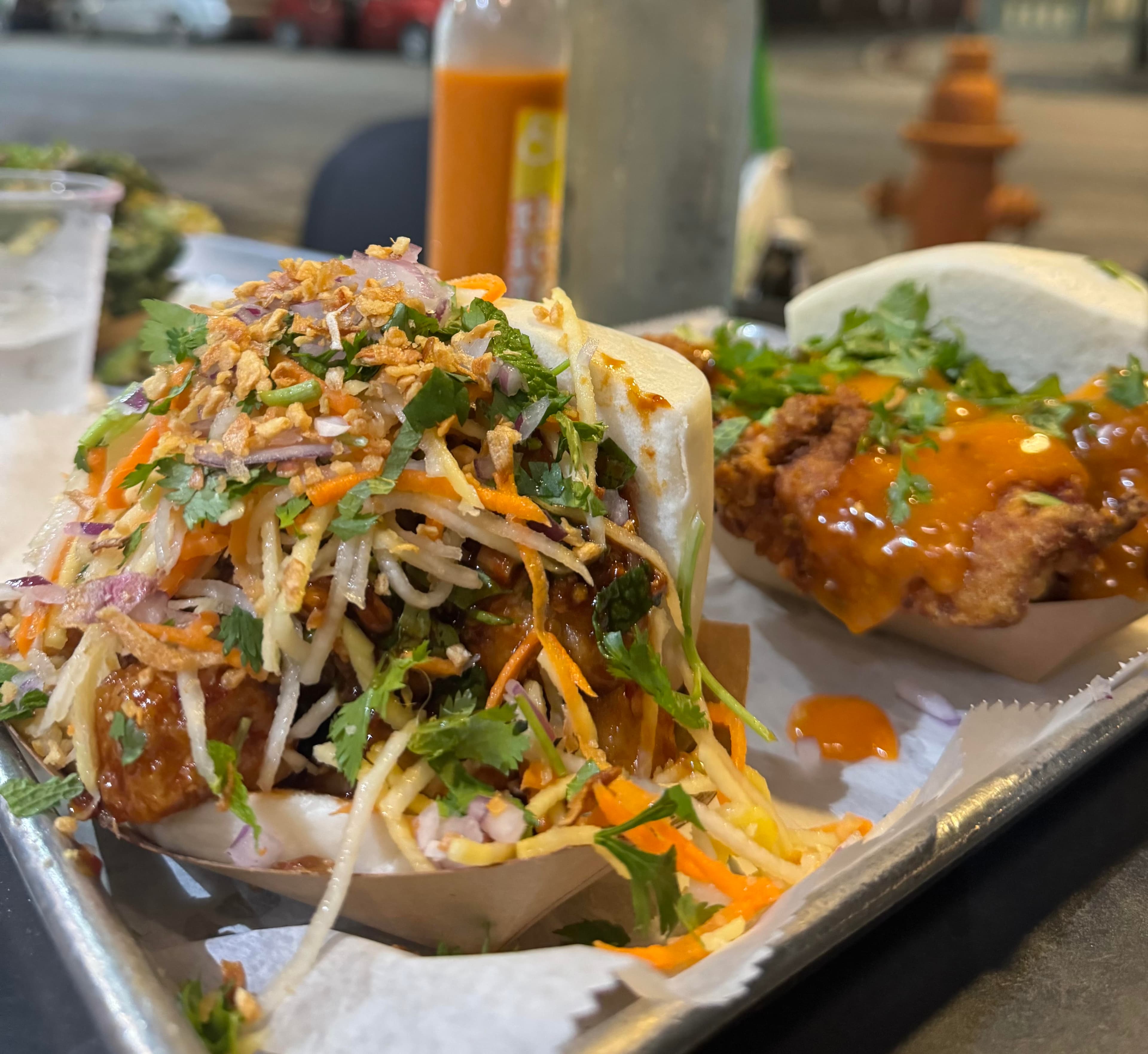 Ekiben bao buns with crispy chicken, herbs, and vegetables