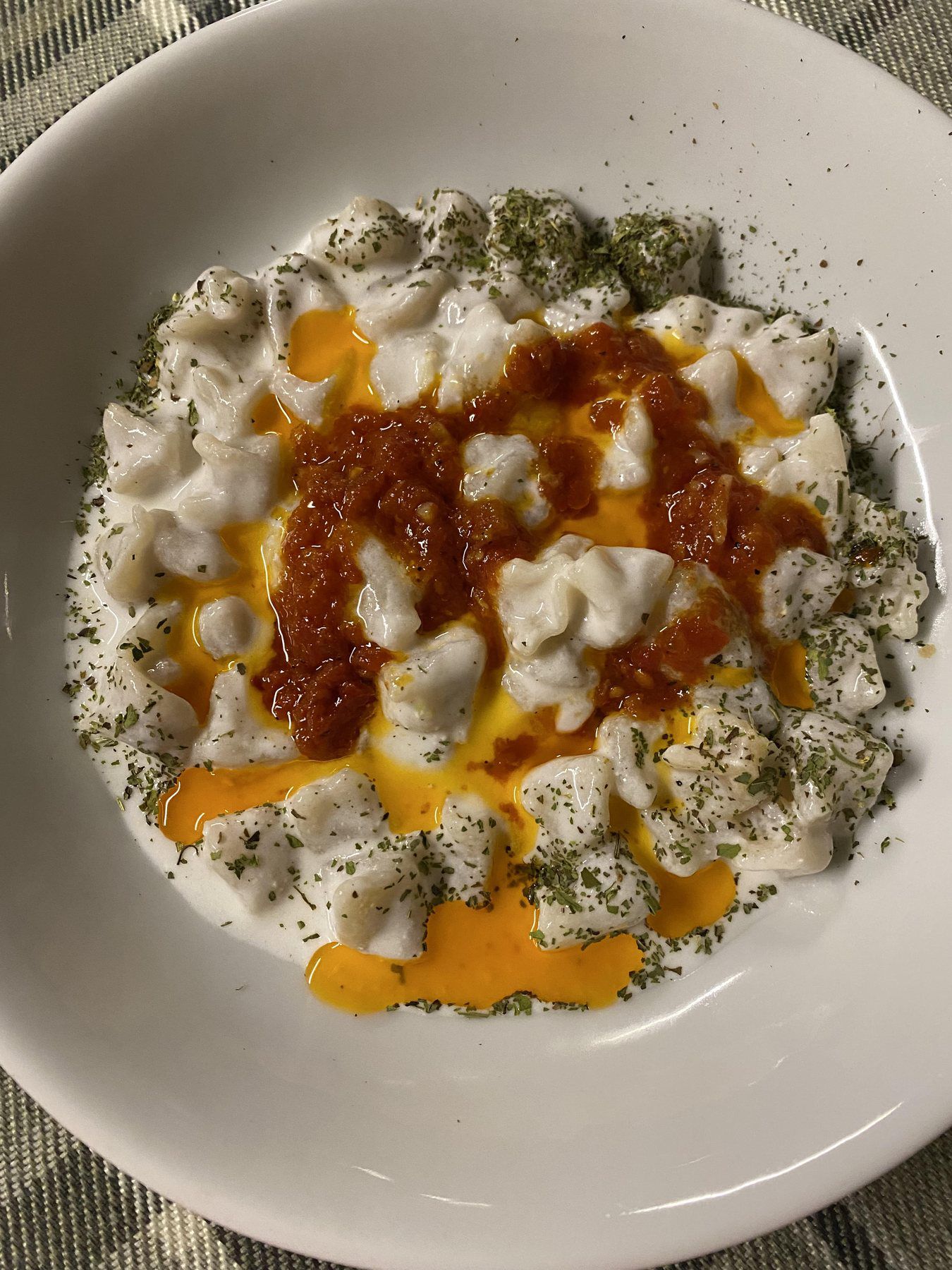 Turkish manti dumplings with yogurt and butter sauce