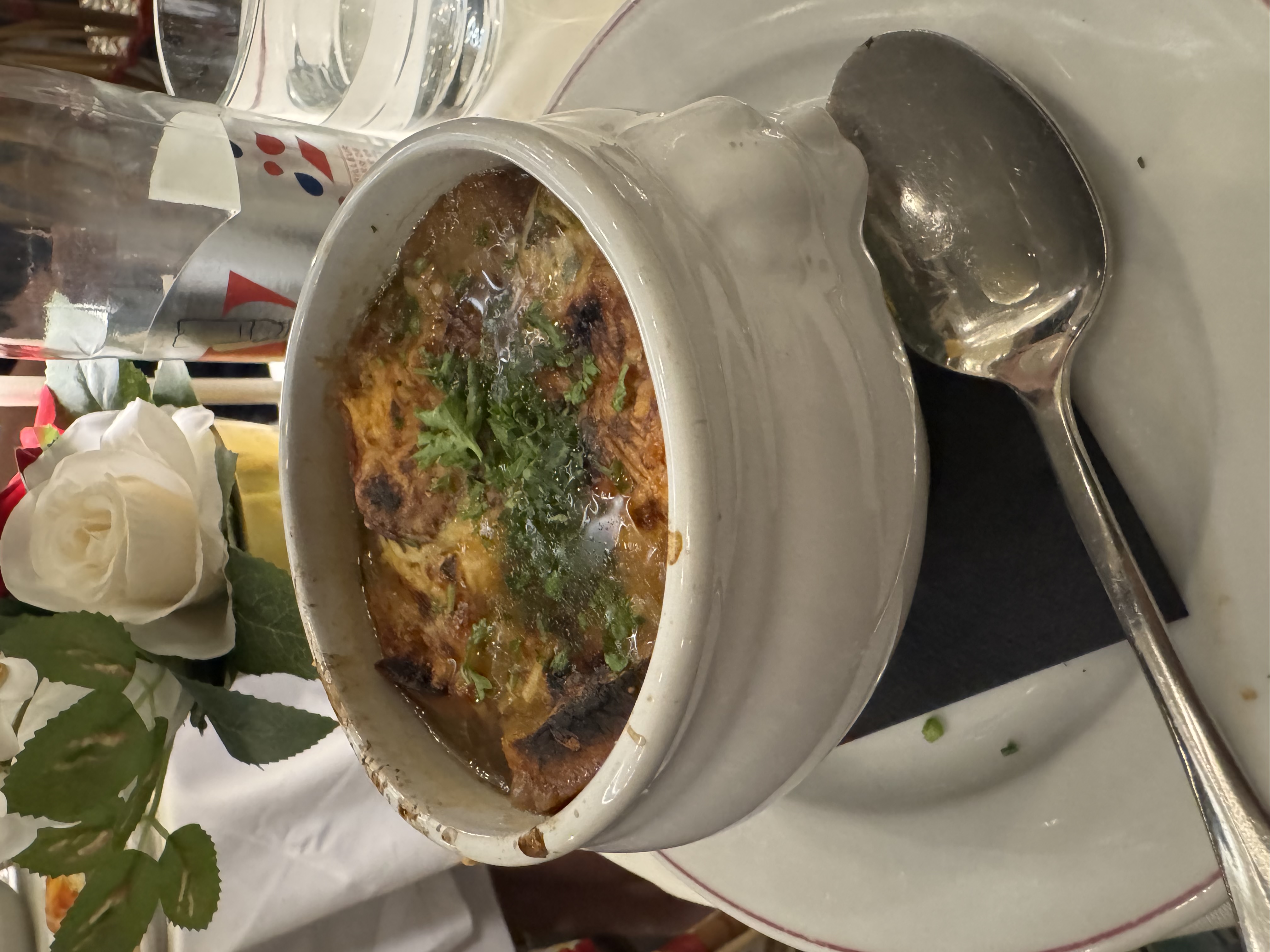 French onion soup topped with melted cheese and toast