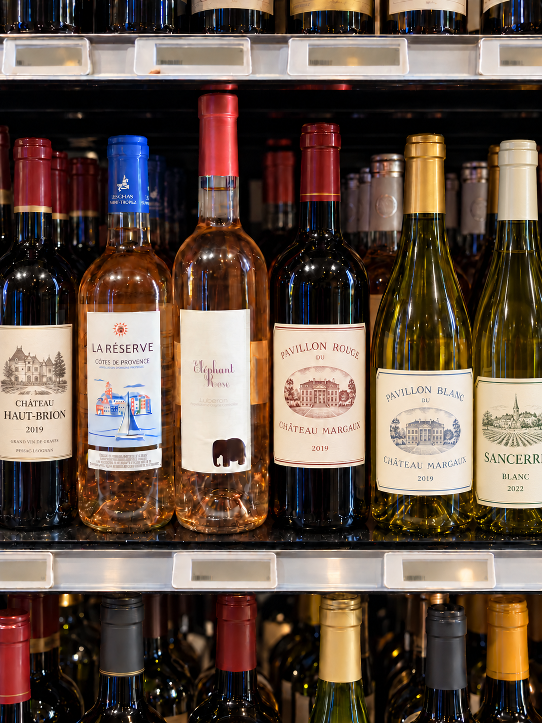 French rosé wine bottles displayed in a wine shop