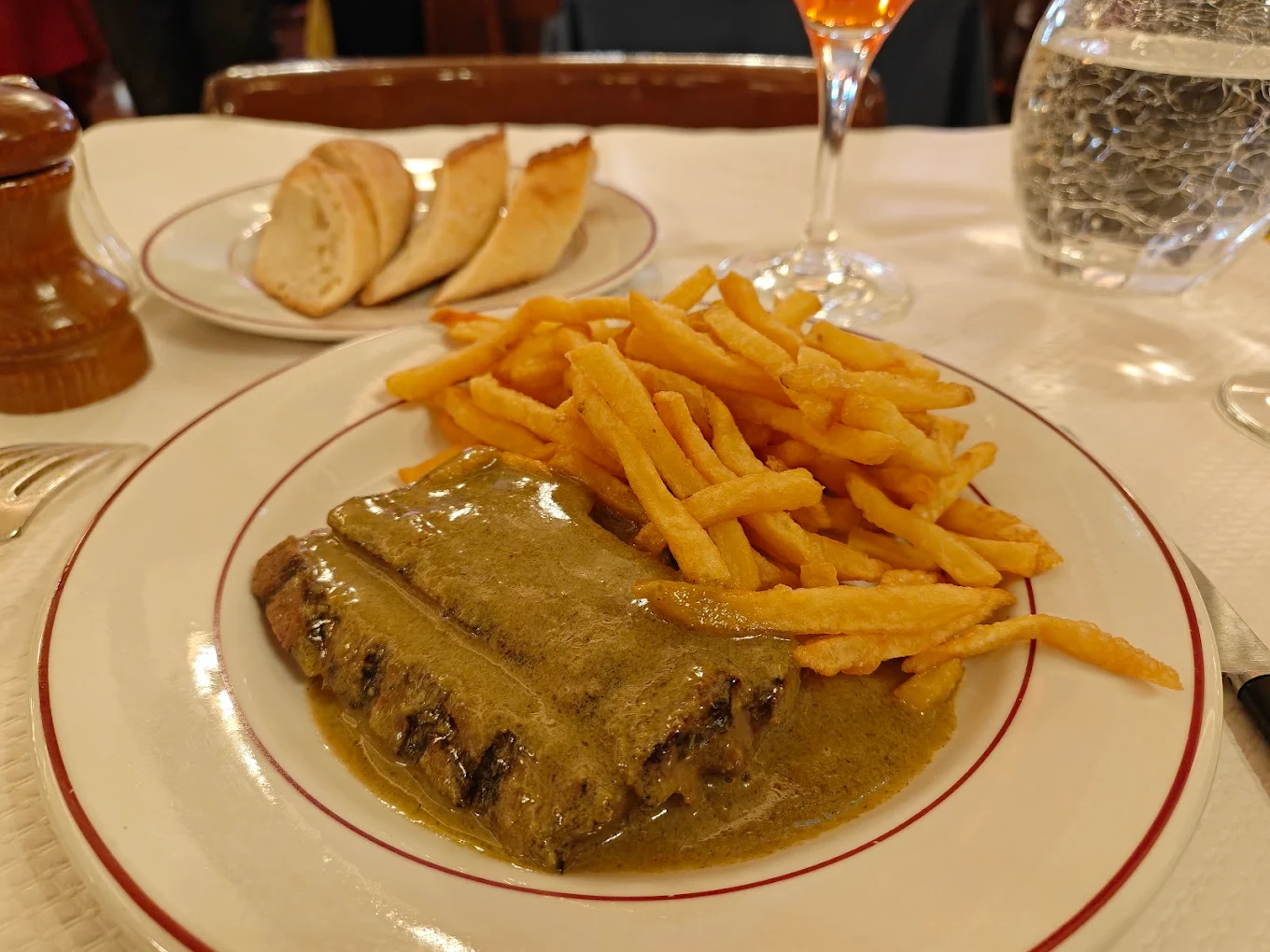 Steak frites with pepper sauce served in a Paris restaurant