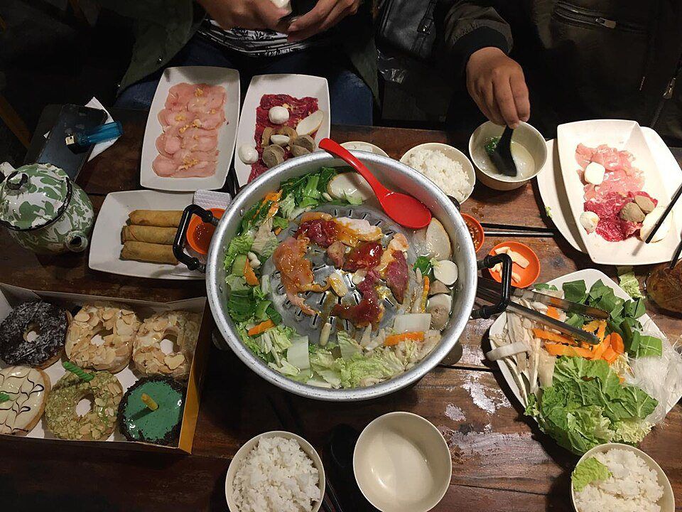 Japanese shabu shabu hot pot with sliced meat